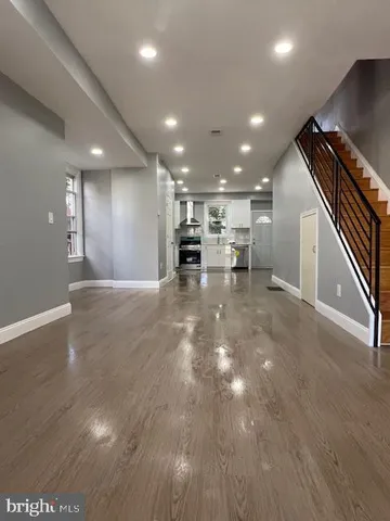 a view of kitchen with cabinets and wooden floor