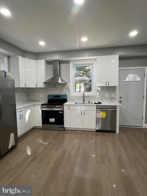 710 Main Street Darby, PA 19023 - Photo 6 of 20 a large kitchen with stainless steel appliances granite countertop a stove a sink dishwasher and a refrigerator