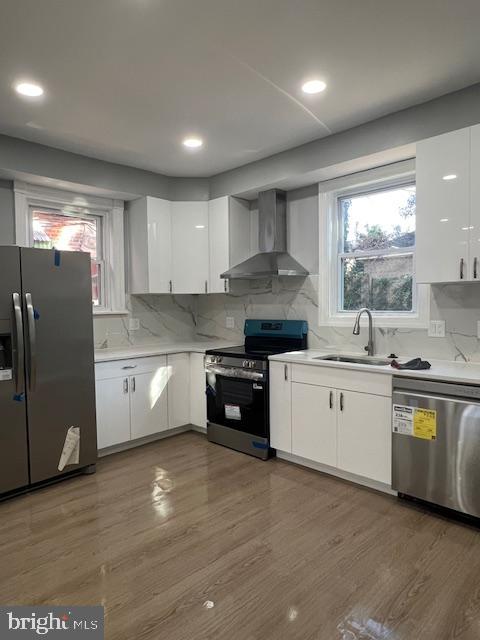 710 Main Street Darby, PA 19023 - Photo 7 of 20 a kitchen with stainless steel appliances granite countertop a stove a sink and a refrigerator