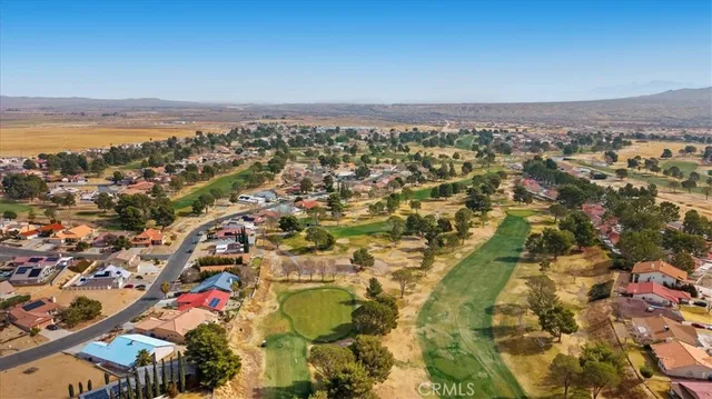 an aerial view of residential building and ocean