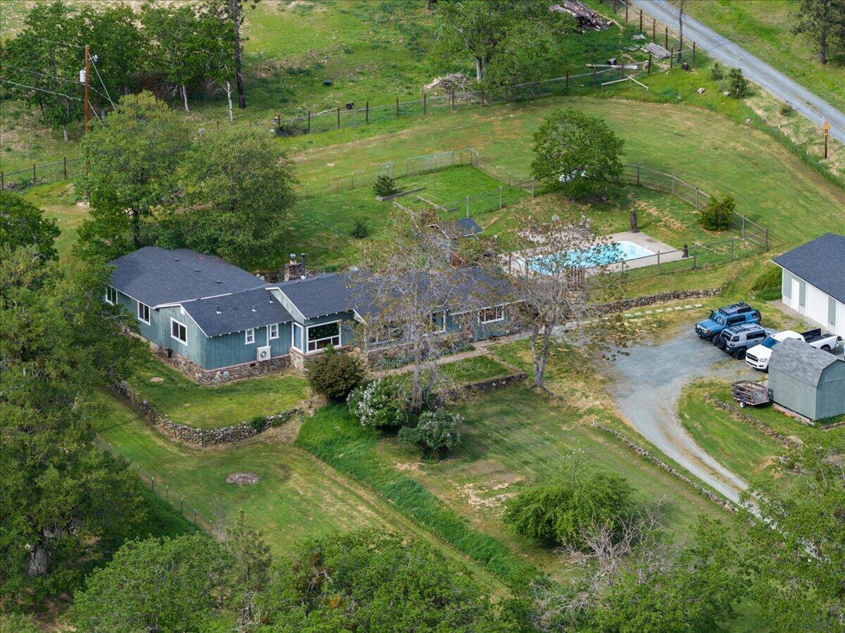 1360 Oxyoke Road Grants Pass, OR 97526 - Photo 2 of 39 an aerial view of residential houses with outdoor space and trees