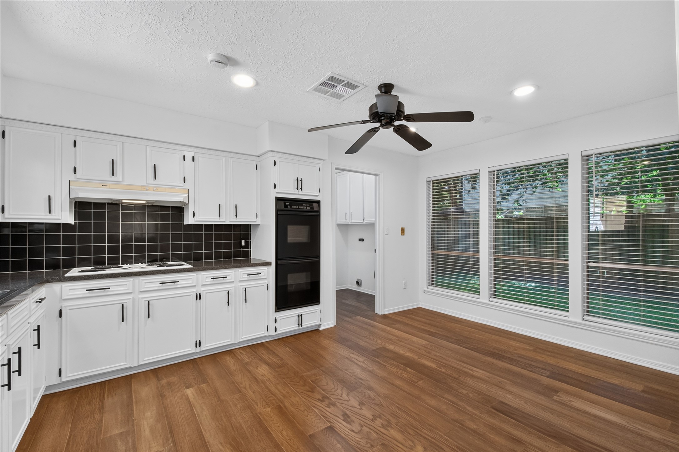 25223 Lynbriar Lane Spring, TX 77373 - Photo 10 of 32 The oversized kitchen offers an abundance of cabinetry, generous counter space, and a spacious breakfast area surrounded by windows overlooking the backyard. Recessed lighting, updated hardware, and ample workspace make this kitchen both functional and inviting.