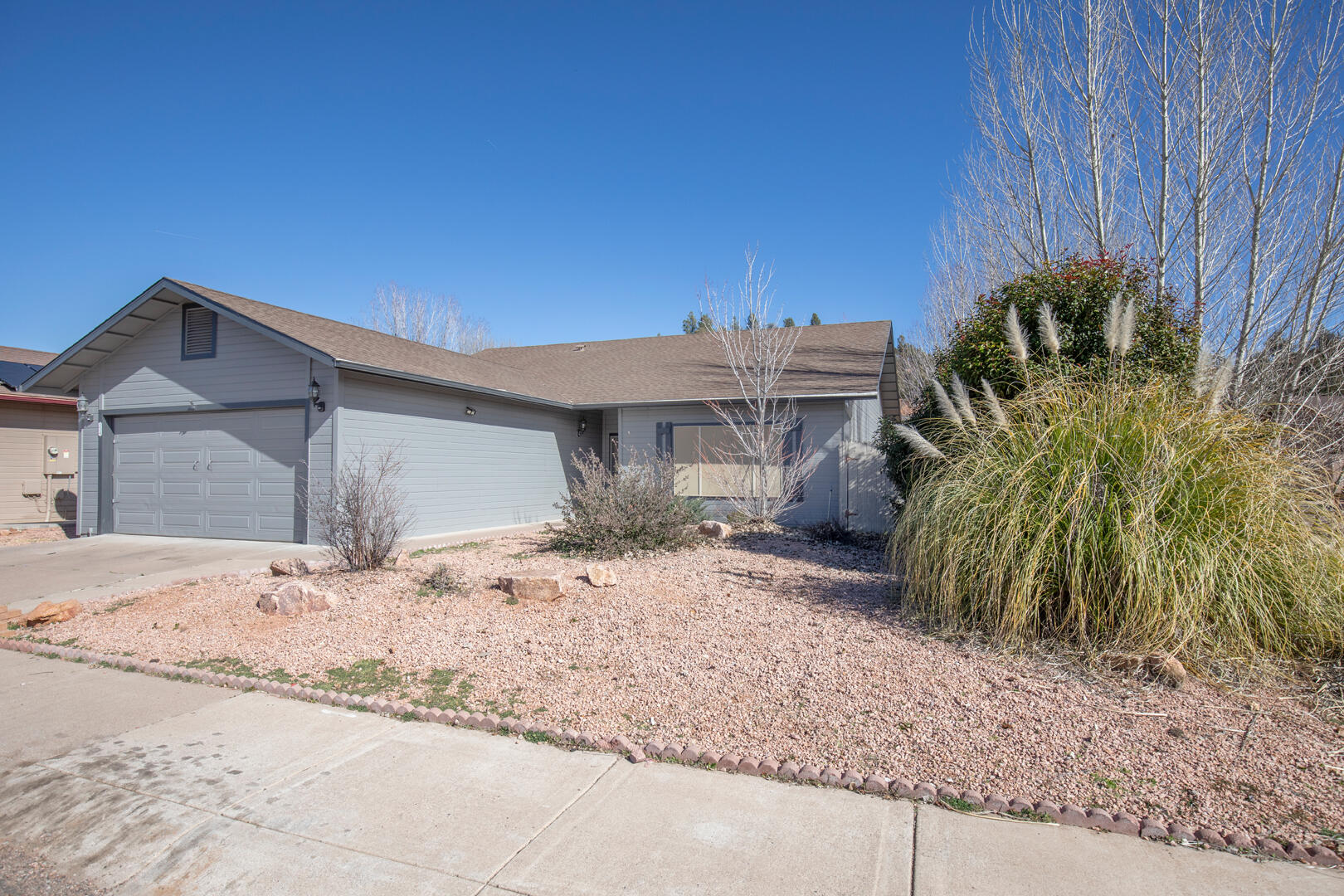 334 East Cedar Mill Road Star Valley, AZ 85541 - Photo 2 of 32 a view of a house with a yard and plant