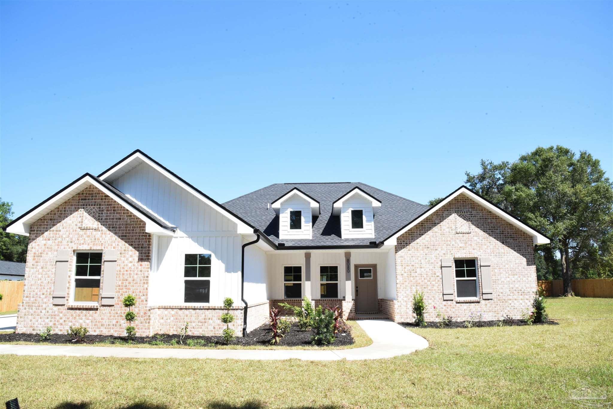 8080 Pinus Lane Pensacola, FL 32534 - Photo 1 of 25 a front view of house with yard