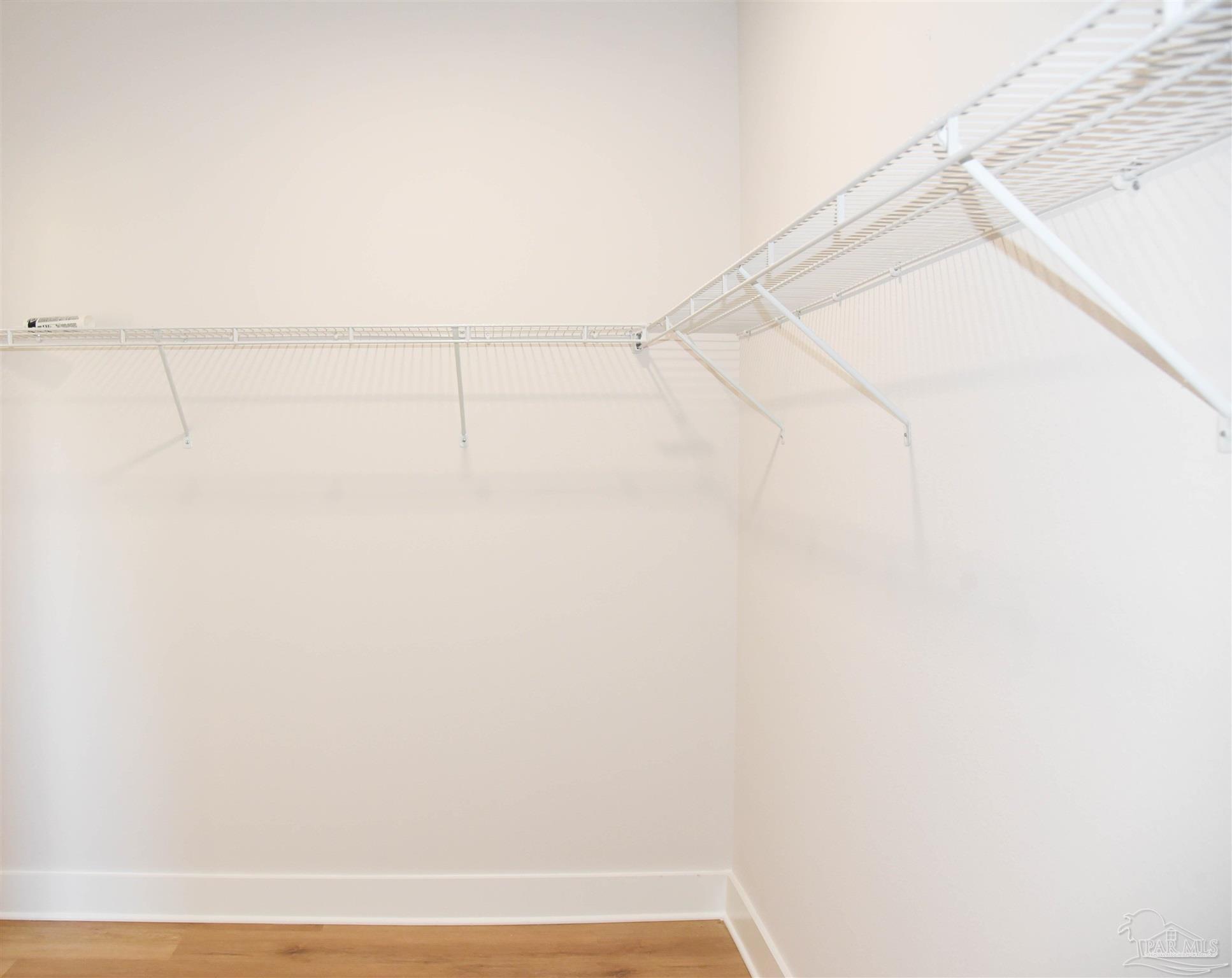 8080 Pinus Lane Pensacola, FL 32534 - Photo 19 of 25 a view of small space with racks on the wall