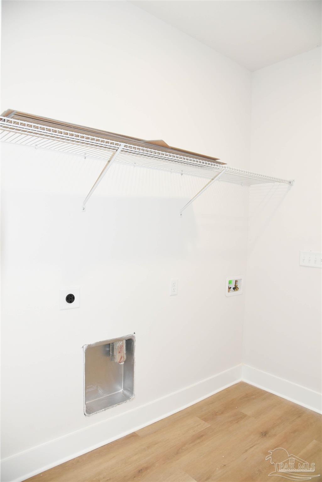 8080 Pinus Lane Pensacola, FL 32534 - Photo 21 of 25 a view of a room with racks on the wall