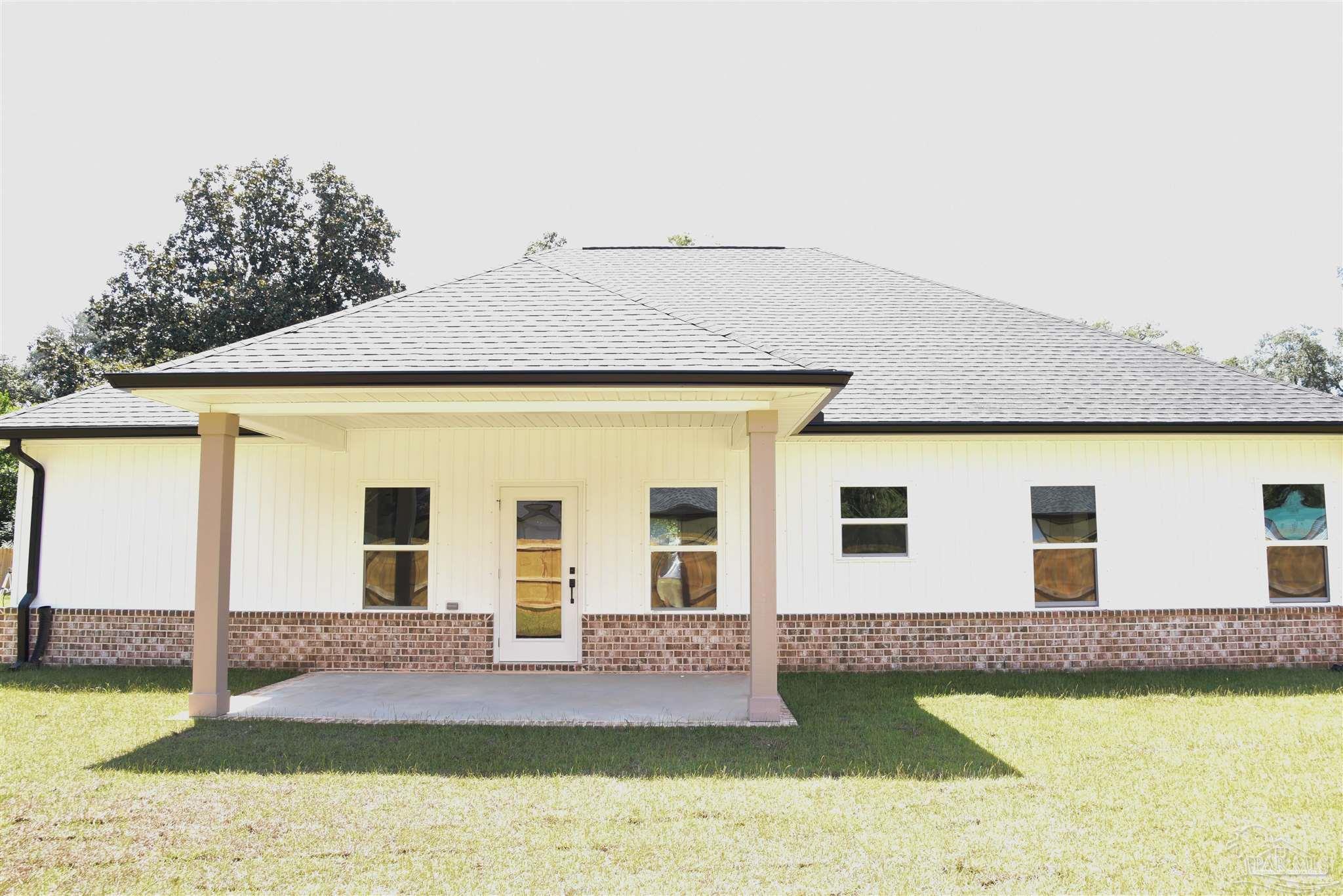 8080 Pinus Lane Pensacola, FL 32534 - Photo 22 of 25 a front view of a house with swimming pool