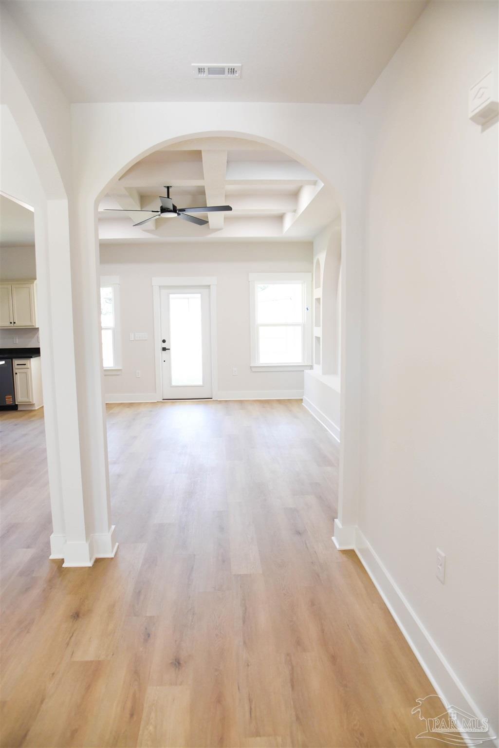 8080 Pinus Lane Pensacola, FL 32534 - Photo 3 of 25 a view of a room with wooden floors and natural light