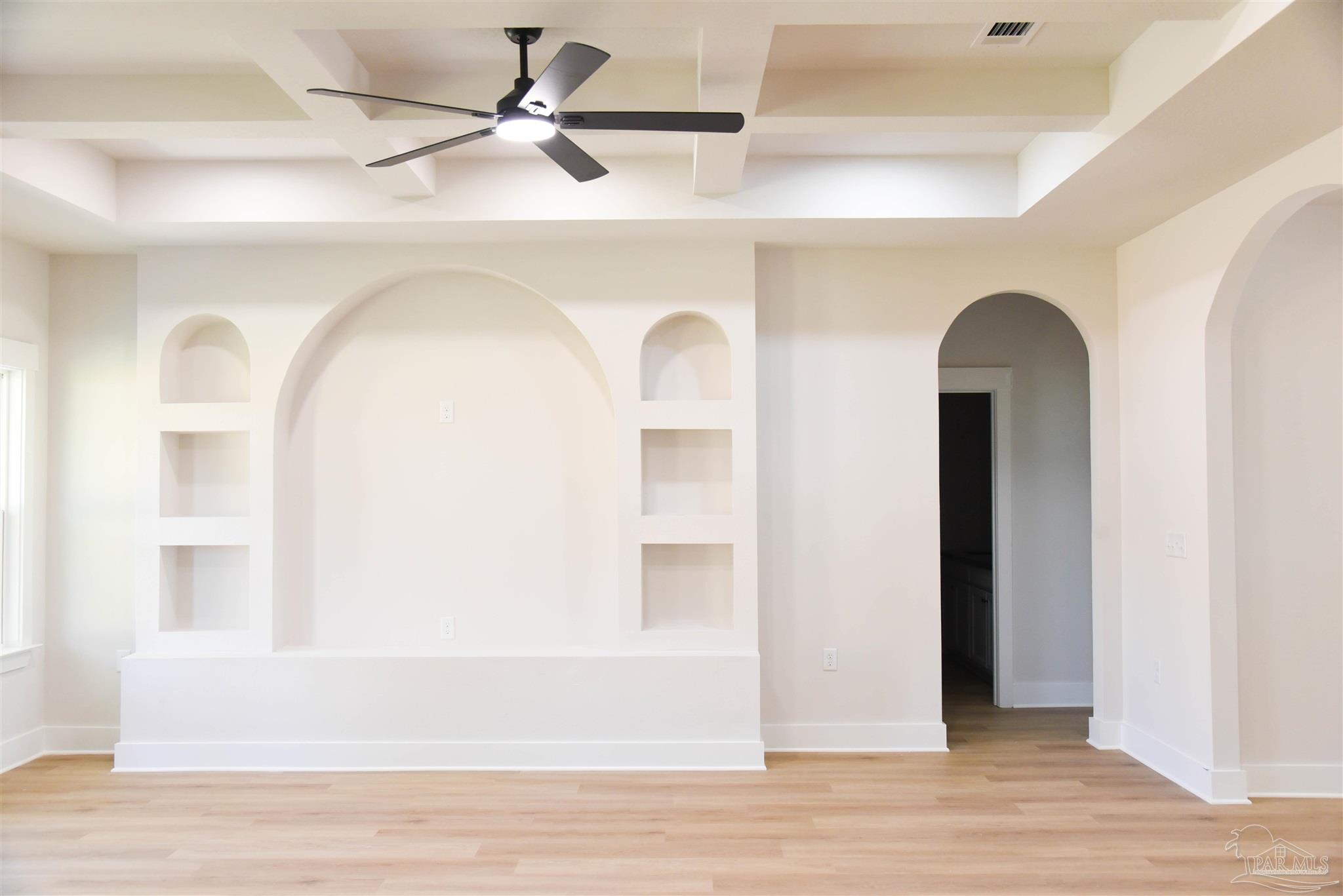 8080 Pinus Lane Pensacola, FL 32534 - Photo 6 of 25 a view of a livingroom with wooden floor and a ceiling fan