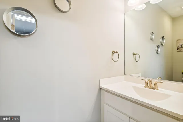 a bathroom with a sink and mirror
