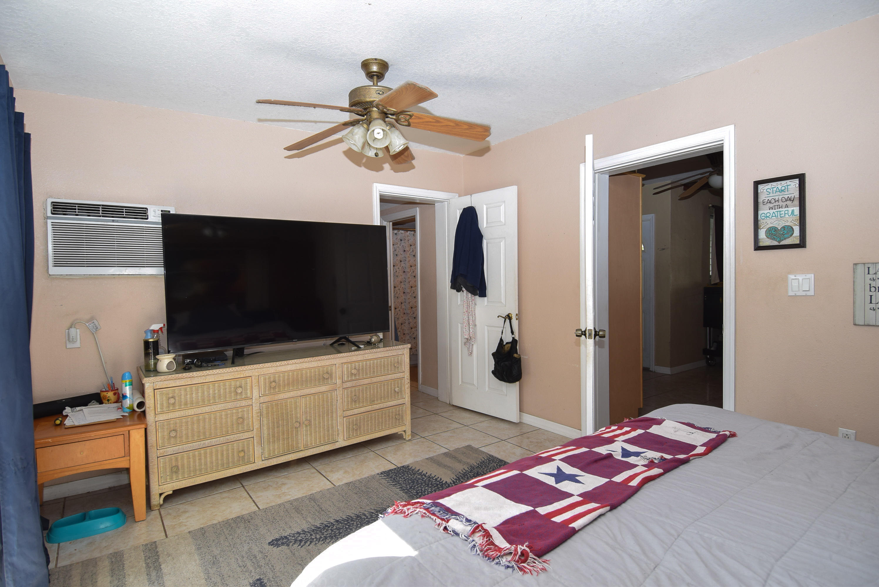 338 3rd Road Key Largo, FL 33037 - Photo 11 of 23 a bedroom with a bed and a flat screen tv