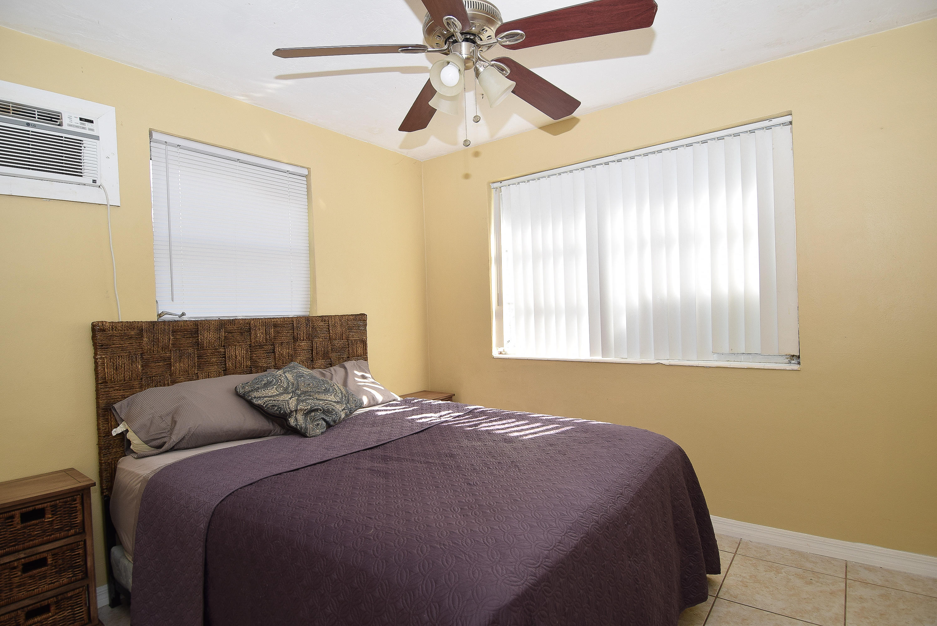 338 3rd Road Key Largo, FL 33037 - Photo 14 of 23 a bedroom with a bed and window