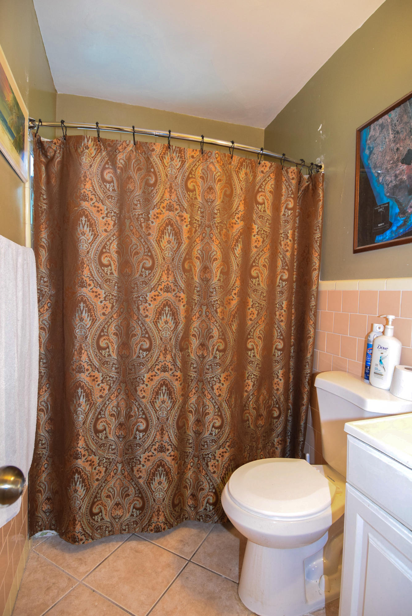 338 3rd Road Key Largo, FL 33037 - Photo 16 of 23 a bathroom with a toilet and shower curtain
