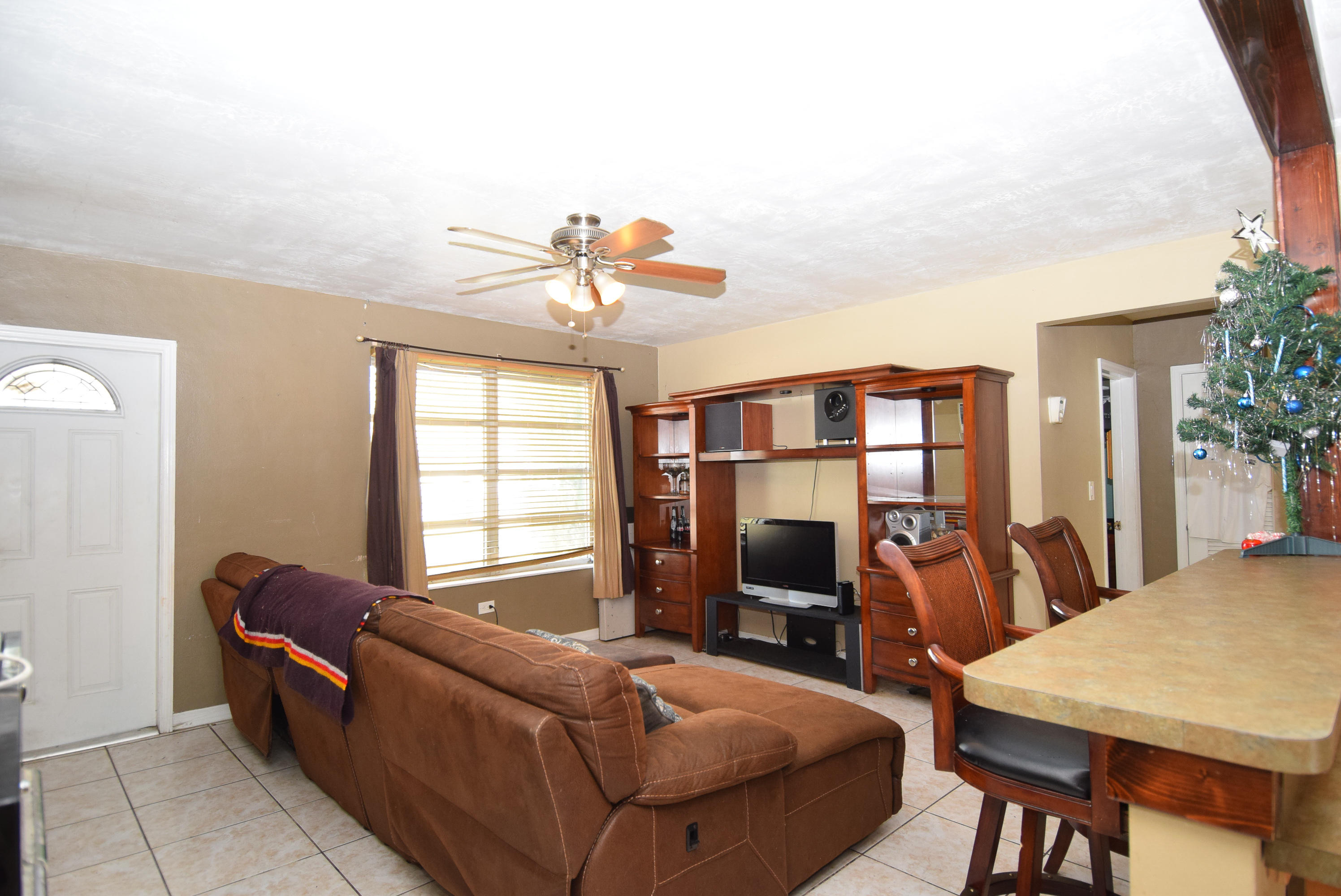 338 3rd Road Key Largo, FL 33037 - Photo 4 of 23 a bedroom with furniture and a chandelier