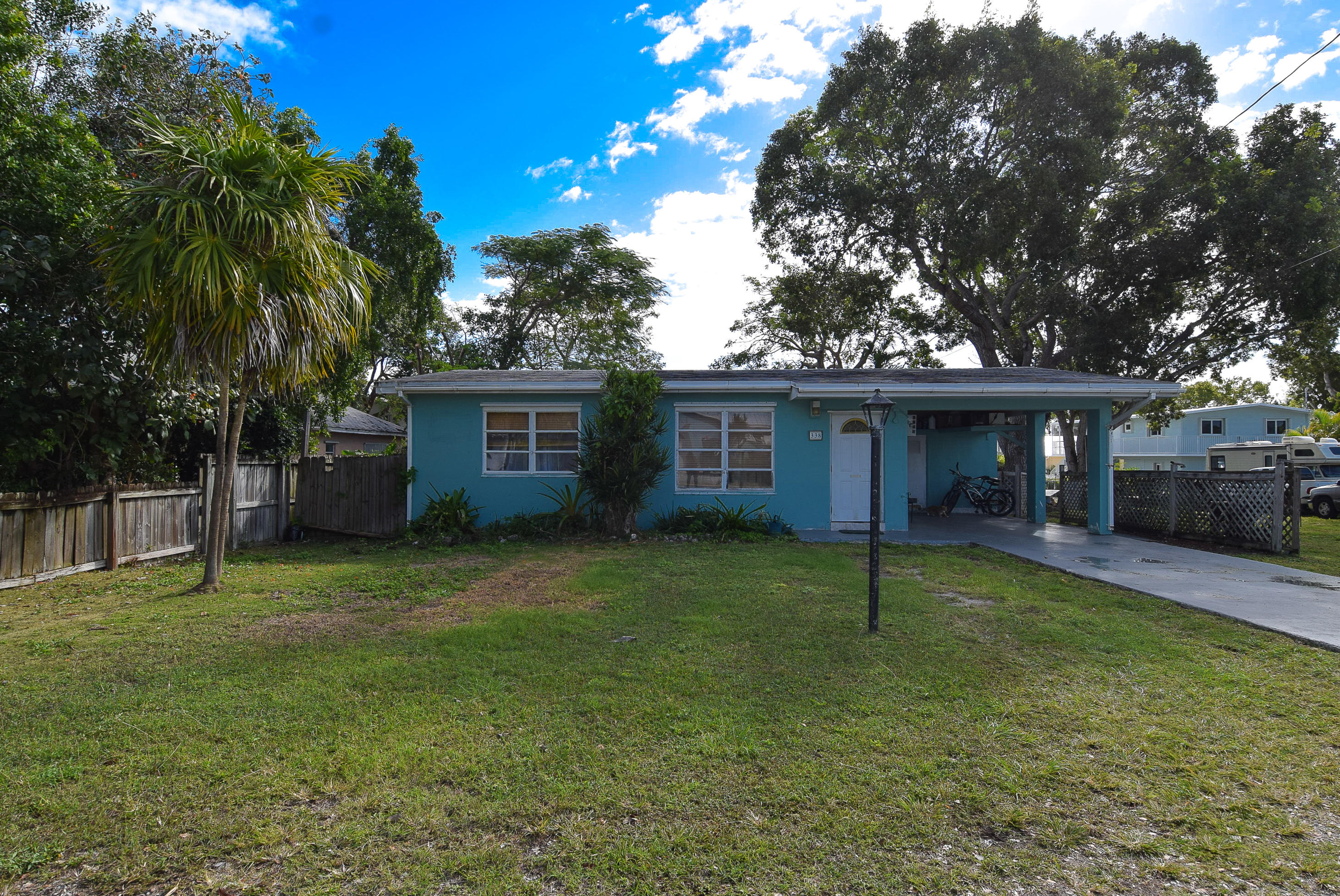 338 3rd Road Key Largo, FL 33037 - Photo 5 of 23 a house view with a sitting space and garden