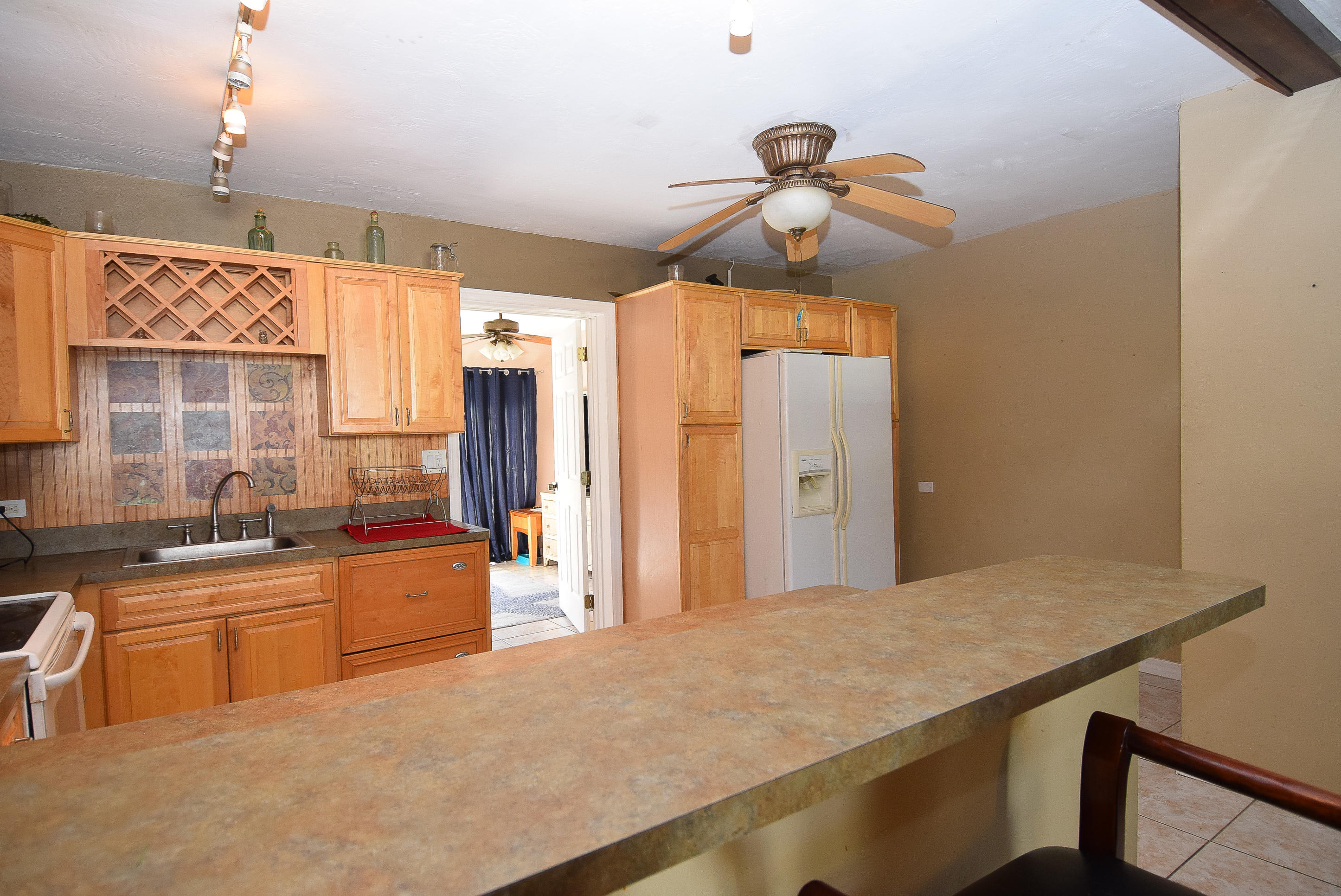 338 3rd Road Key Largo, FL 33037 - Photo 7 of 23 a kitchen with stainless steel appliances a sink stove and refrigerator