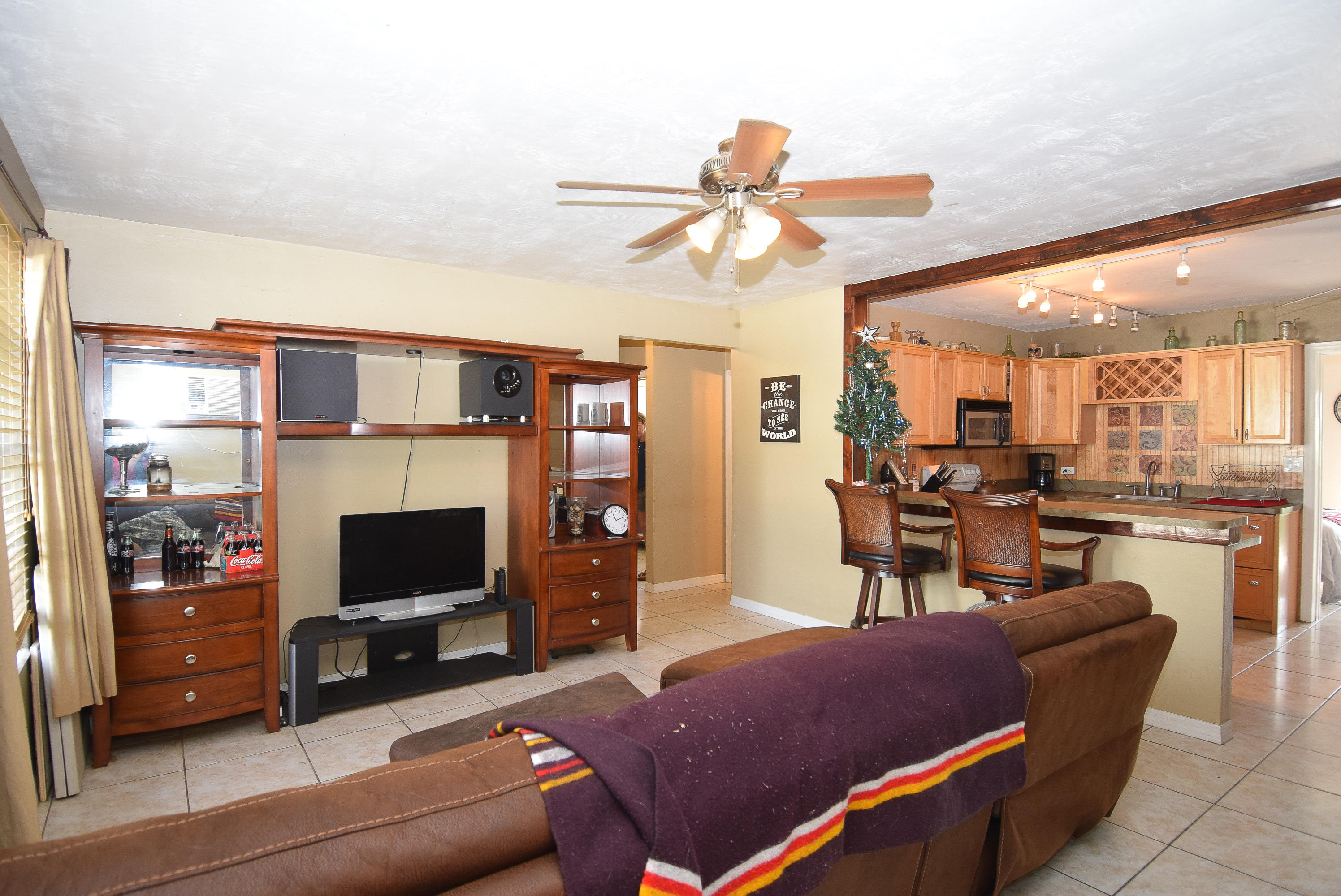 338 3rd Road Key Largo, FL 33037 - Photo 8 of 23 a living room with furniture a flat screen tv and a fireplace