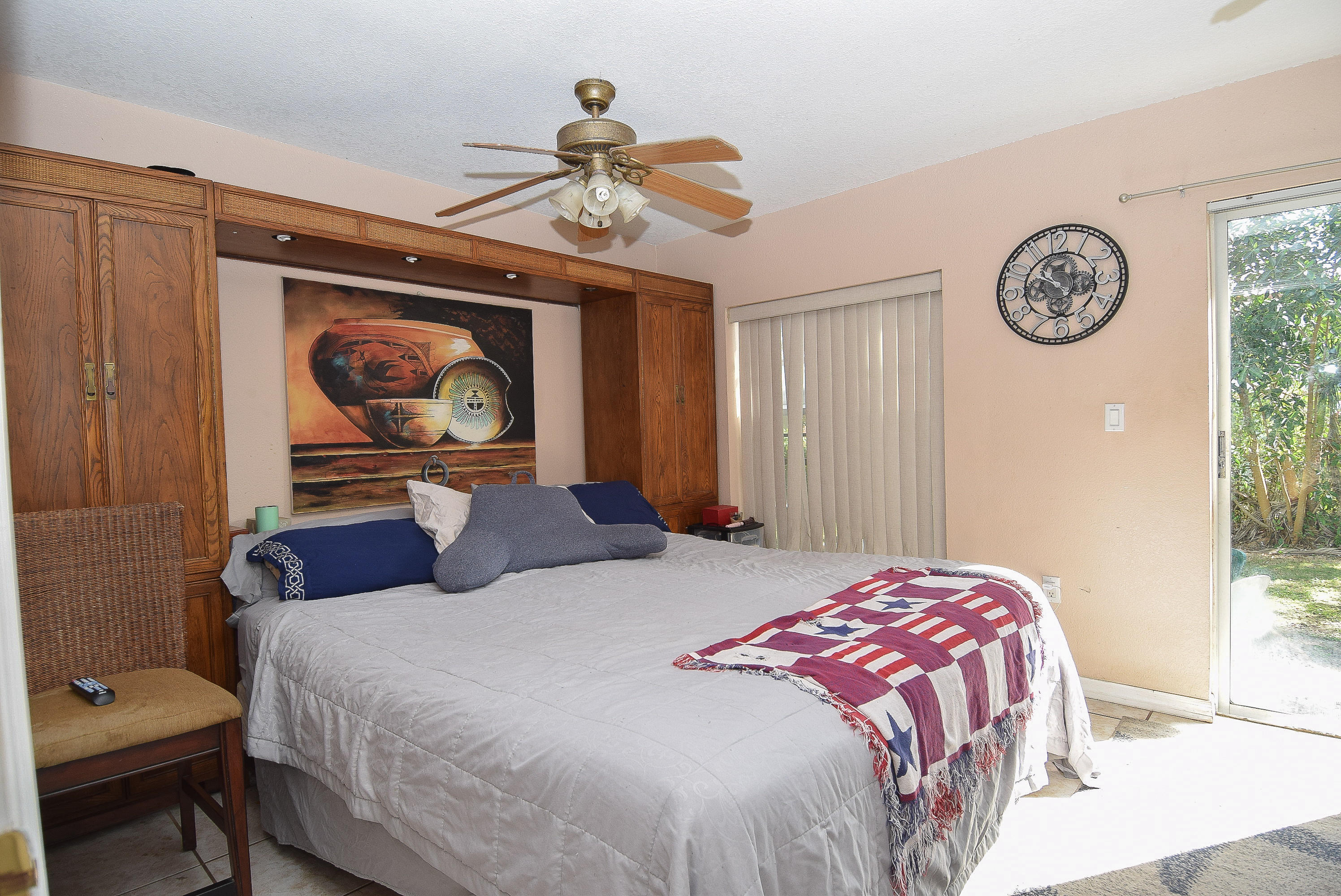338 3rd Road Key Largo, FL 33037 - Photo 10 of 23 a bedroom with a bed and a chandelier