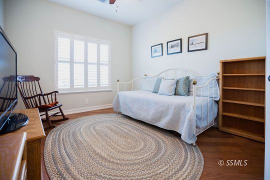 2401 Lacey Street Ridgecrest, CA 93555 - Photo 25 of 44 a bedroom with a bed and a window