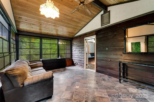 a view of washer and dryer with bathroom in the background