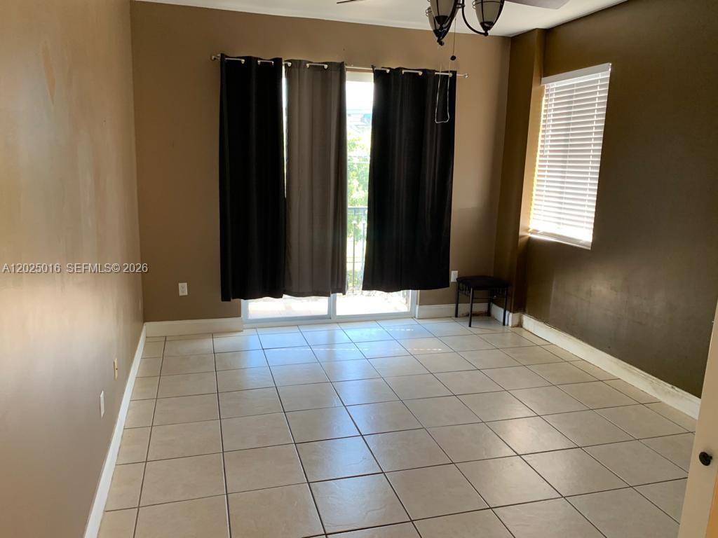 400 Southwest 2nd Street, Unit 201 Miami, FL 33130 - Photo 7 of 12 a view of a livingroom with entryway and window