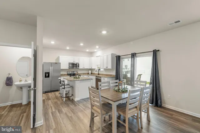 a kitchen with a table and chairs in it