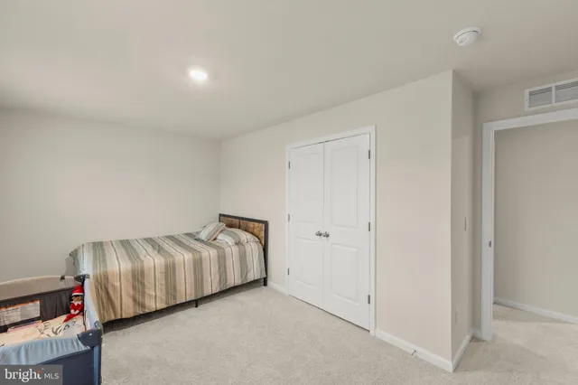 a view of a livingroom with furniture and closet