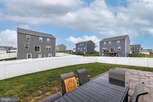 a view of a house with a back yard