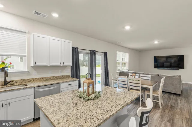 a kitchen with a table and chairs in it
