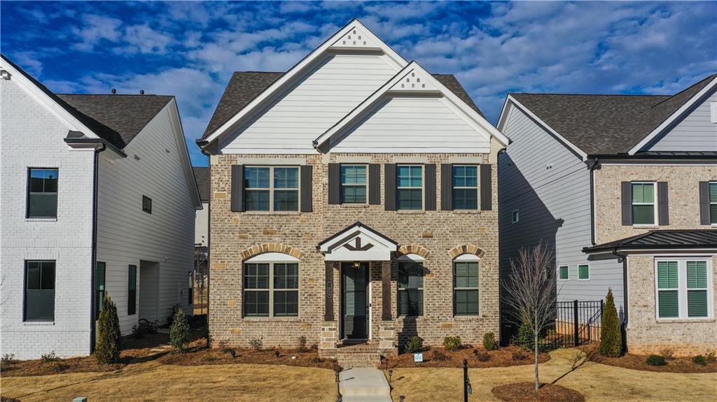 a front view of a house with a yard