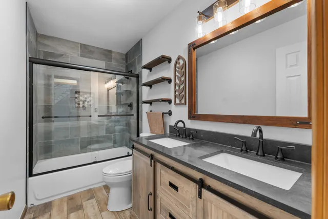 an empty room with a ceiling fan and a window