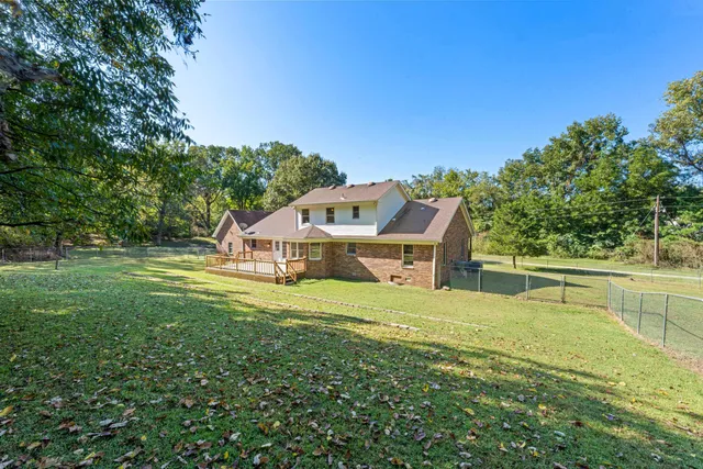an aerial view of residential house with outdoor space and swimming pool