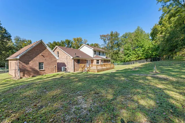 a view of a garden with lawn chairs
