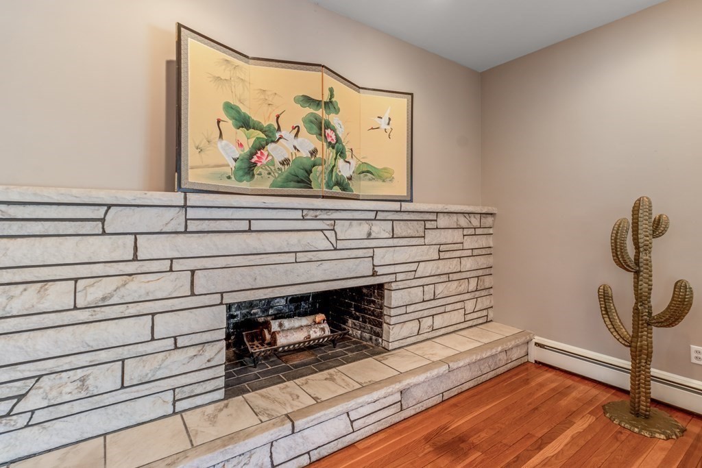 57 Leicester Road Marblehead, MA 01945 - Photo 8 of 39 a view of a fireplace with wooden floor