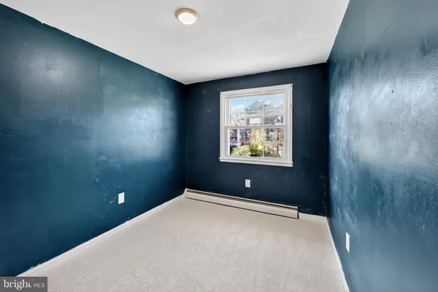 a view of a room with a flat screen tv