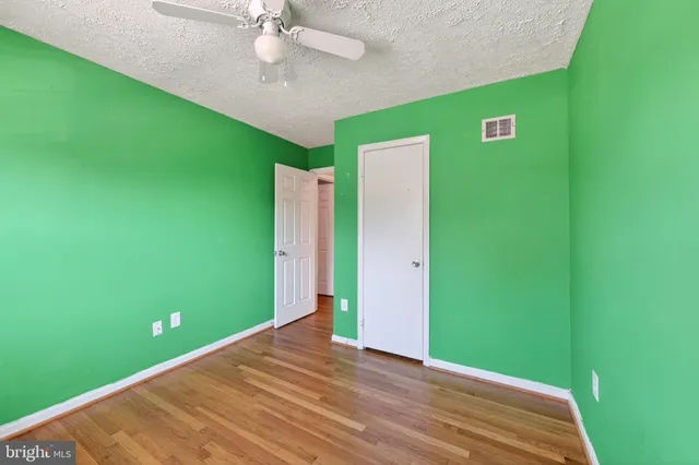 a view of a room with window and fan