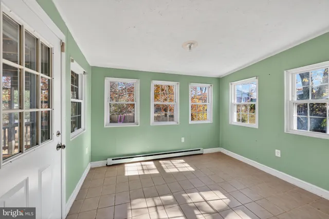 a view of a room with window and stairs