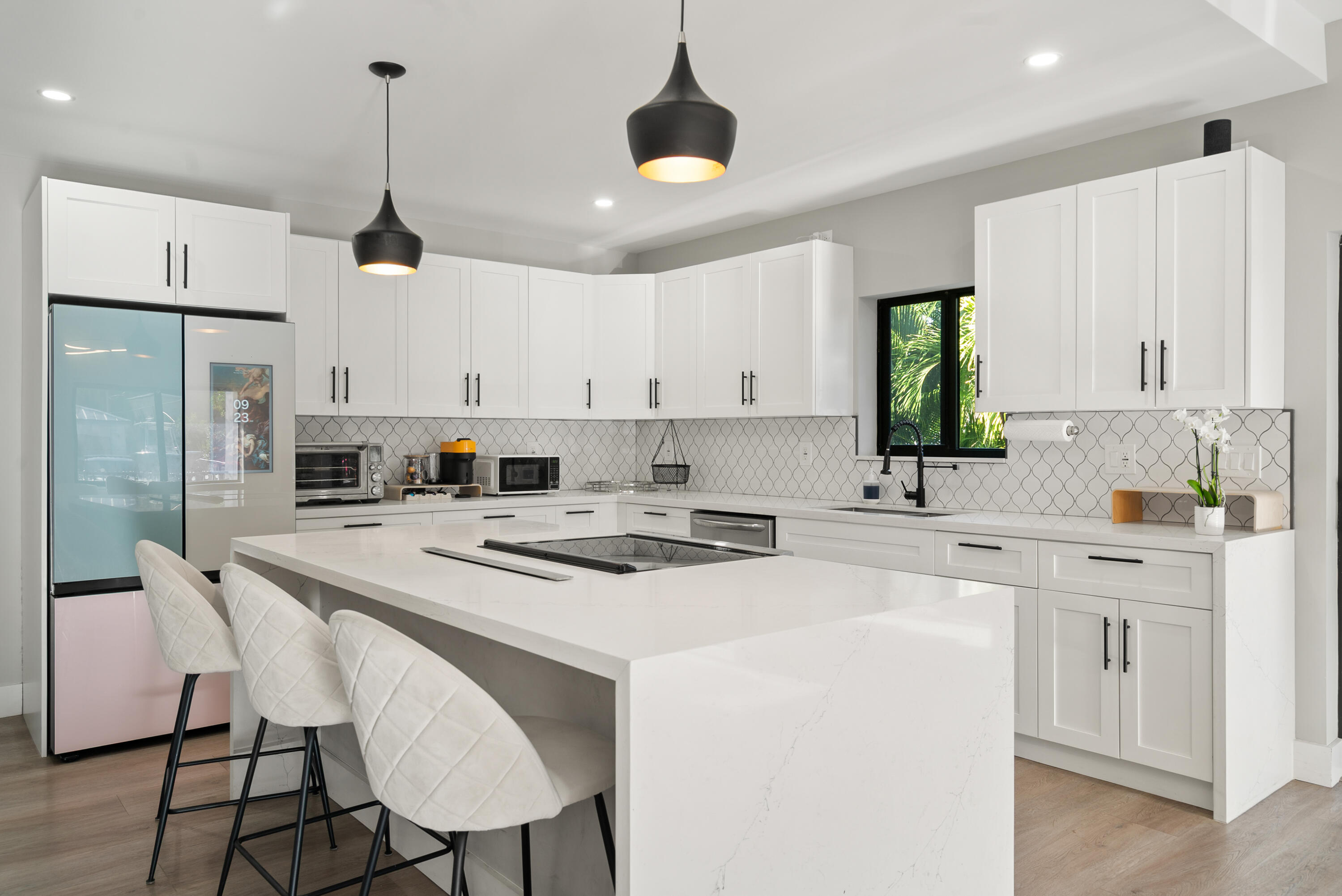13 Coral Way Key Largo, FL 33037 - Photo 5 of 34 a kitchen with stainless steel appliances a stove a sink a refrigerator a center island and a cabinets