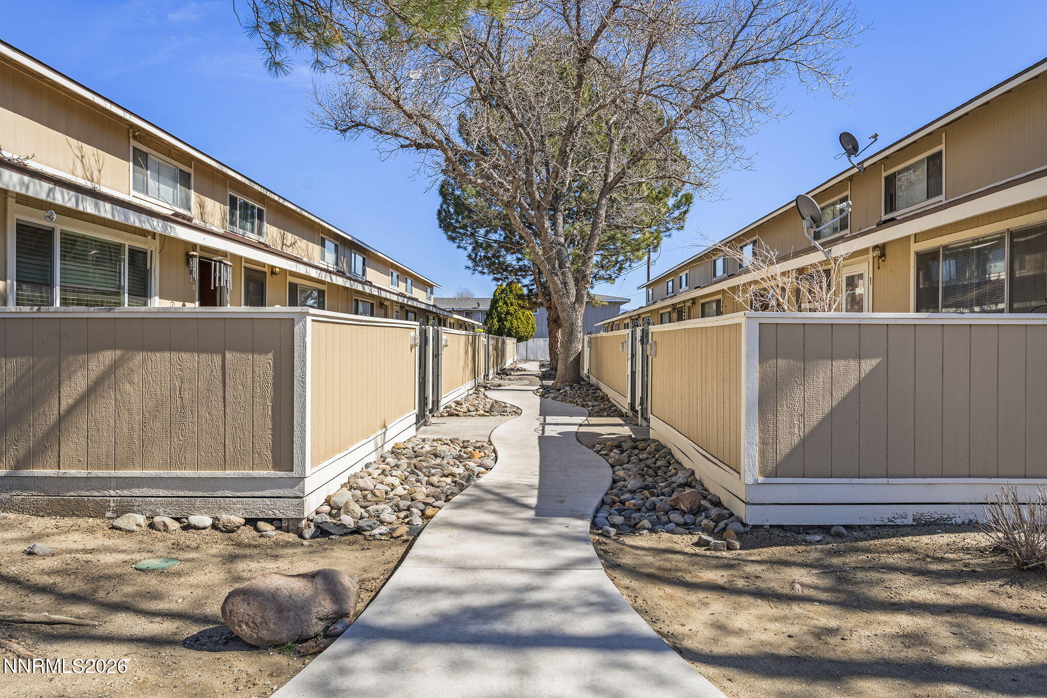 401 Allouette Way, Unit 2 Carson City, NV 89701 - Photo 1 of 29 a front view of a house with a yard