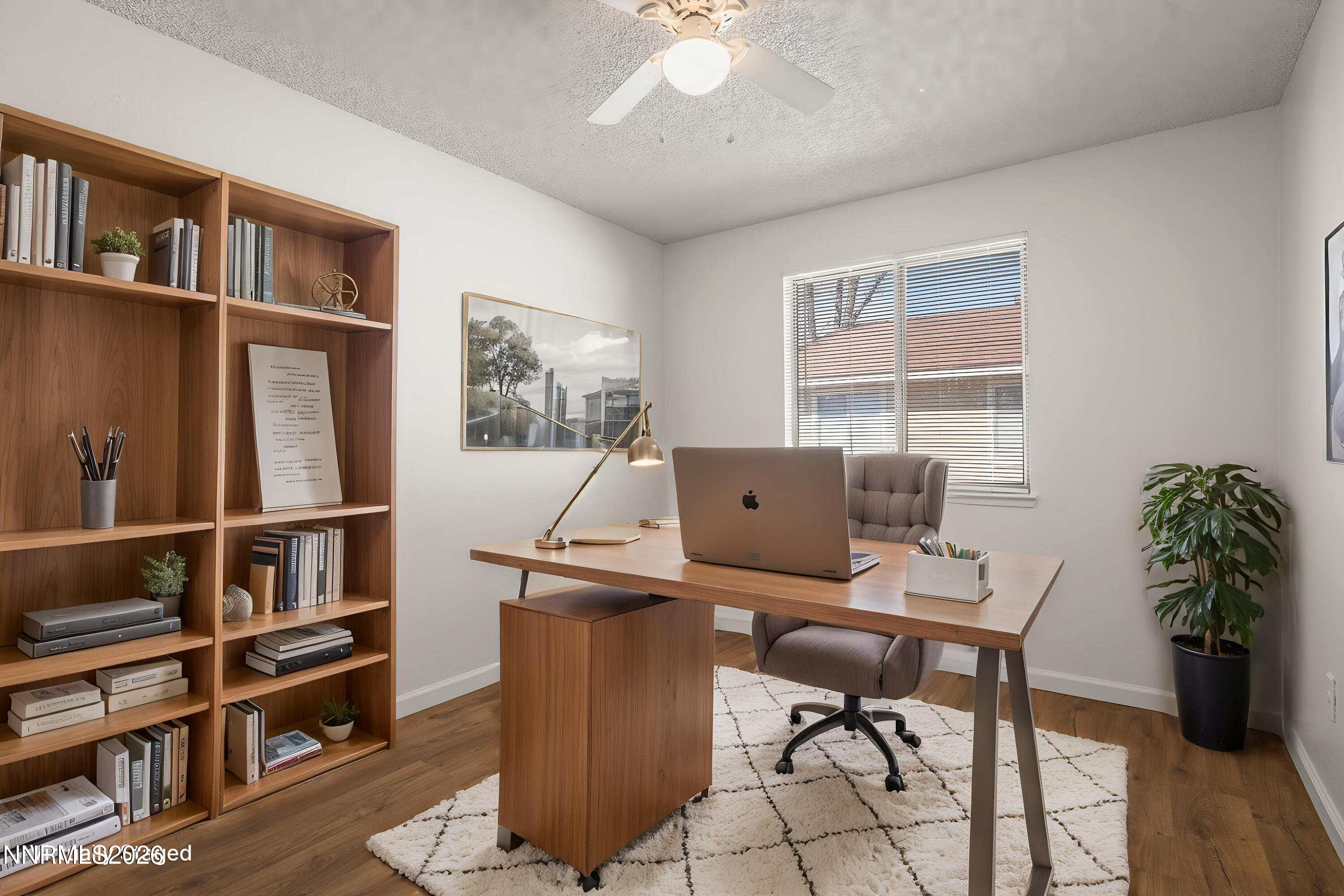 401 Allouette Way, Unit 2 Carson City, NV 89701 - Photo 20 of 29 a view of a workspace with furniture and a bookshelf