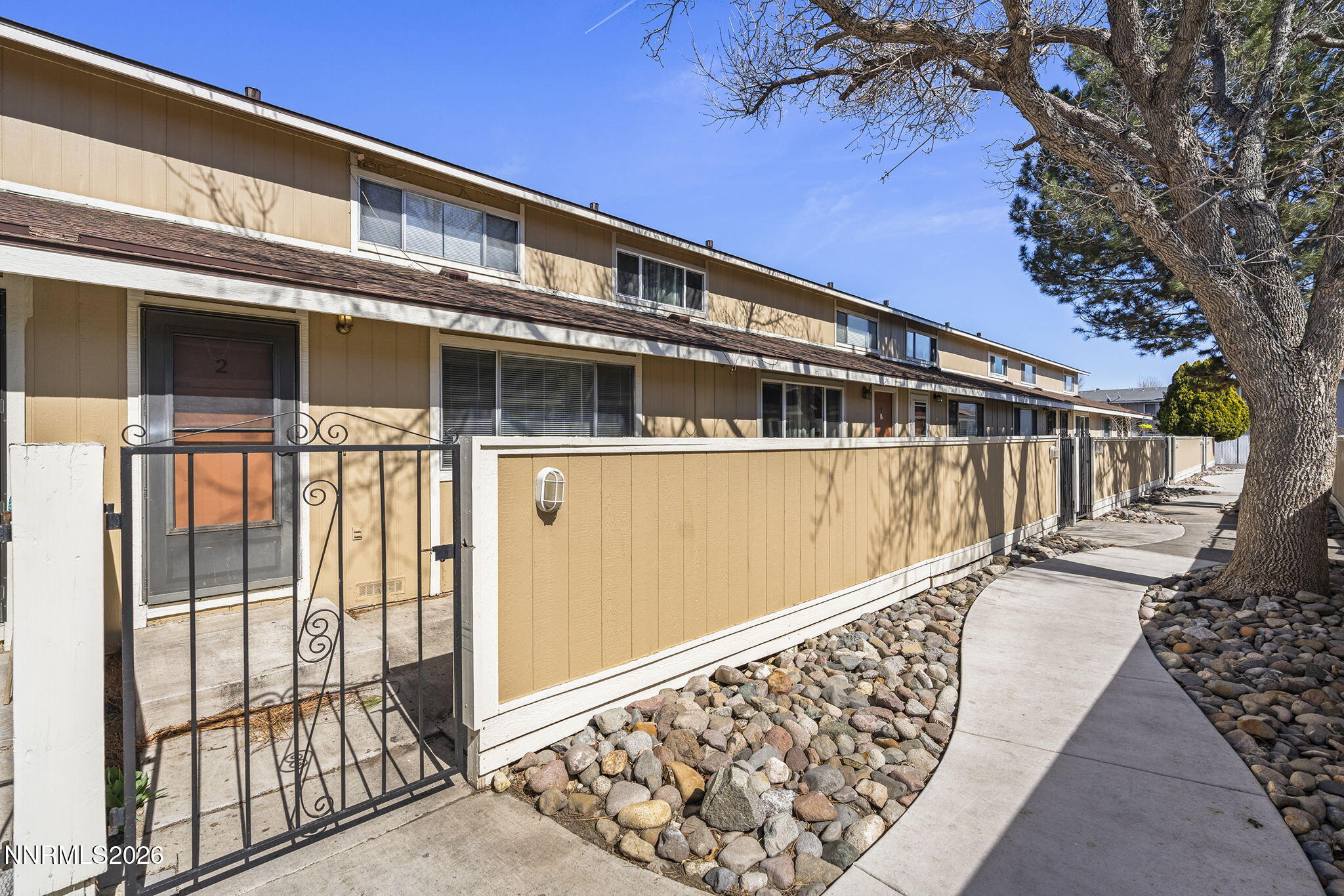 401 Allouette Way, Unit 2 Carson City, NV 89701 - Photo 2 of 29 a front view of a house with large windows