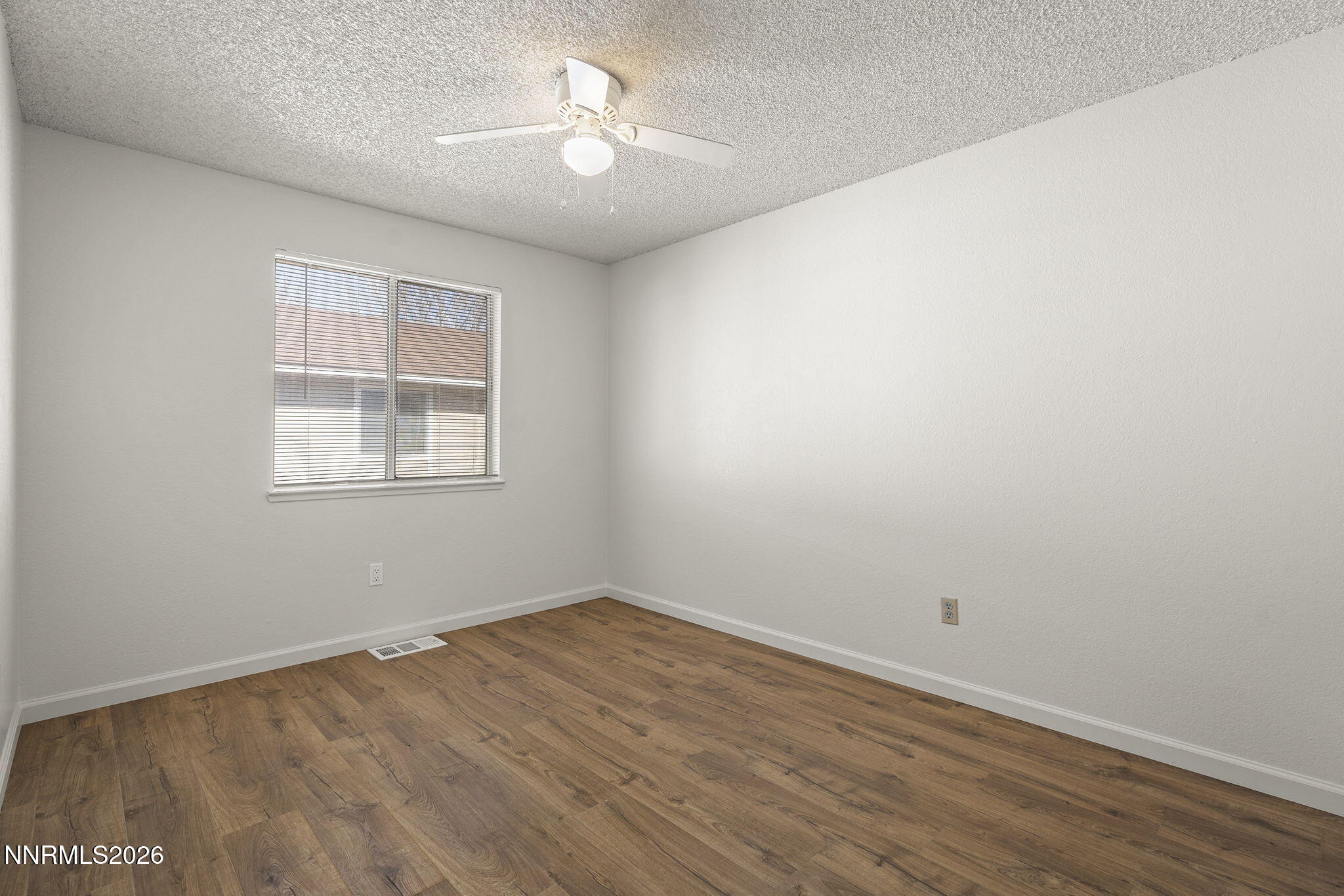 401 Allouette Way, Unit 2 Carson City, NV 89701 - Photo 23 of 29 wooden floor in an empty room with a window