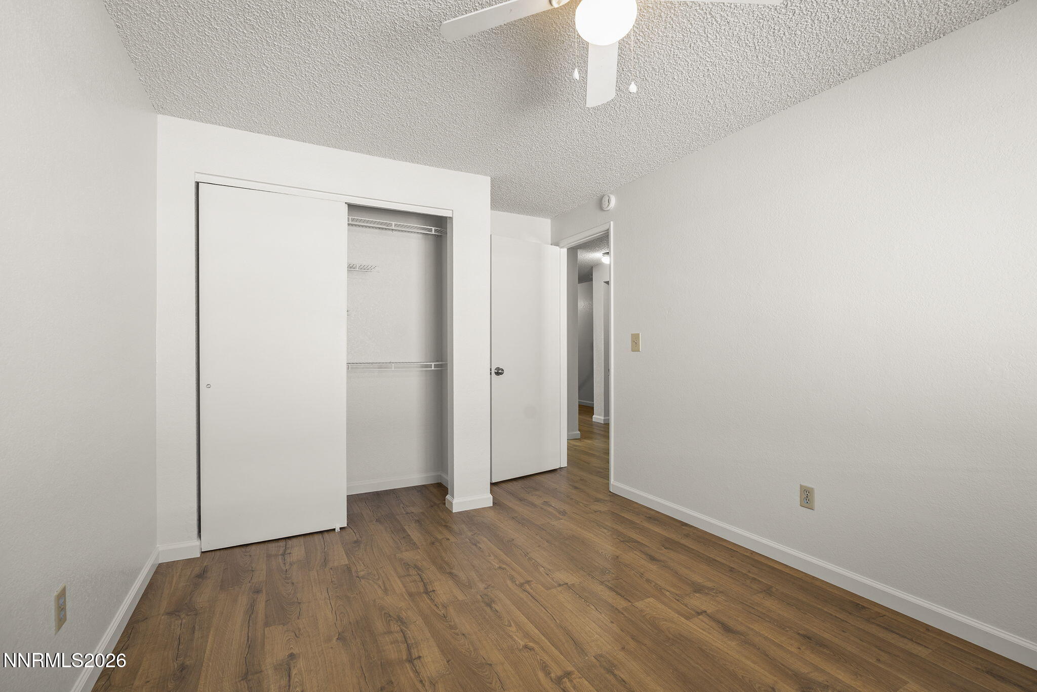 401 Allouette Way, Unit 2 Carson City, NV 89701 - Photo 24 of 29 a view of an empty room with wooden floor
