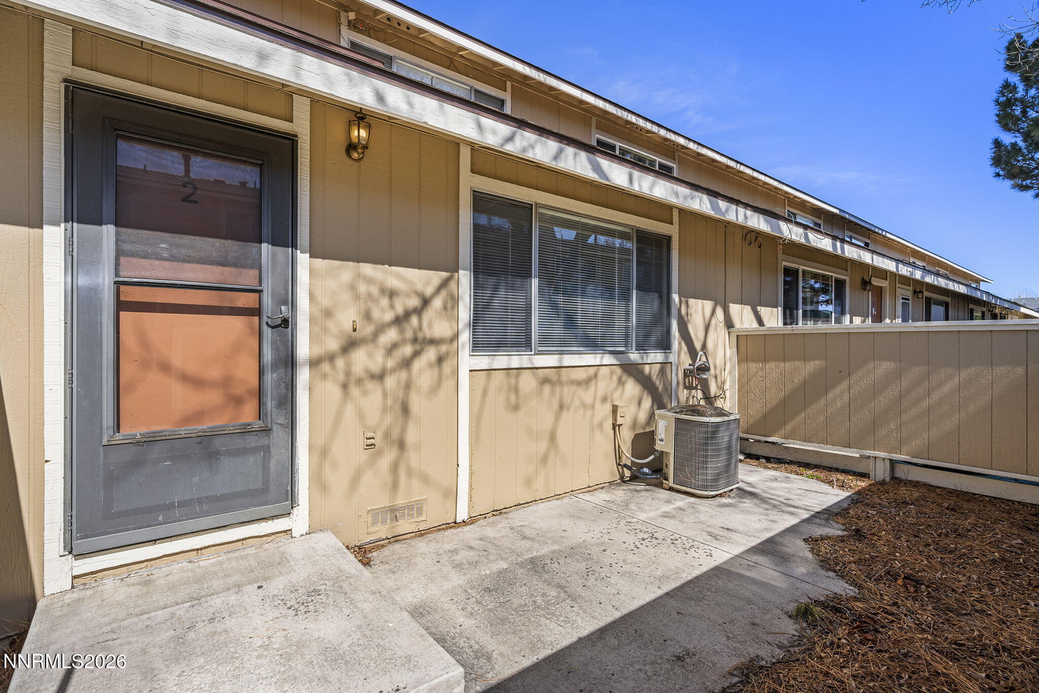 401 Allouette Way, Unit 2 Carson City, NV 89701 - Photo 3 of 29 a front view of a house with a porch