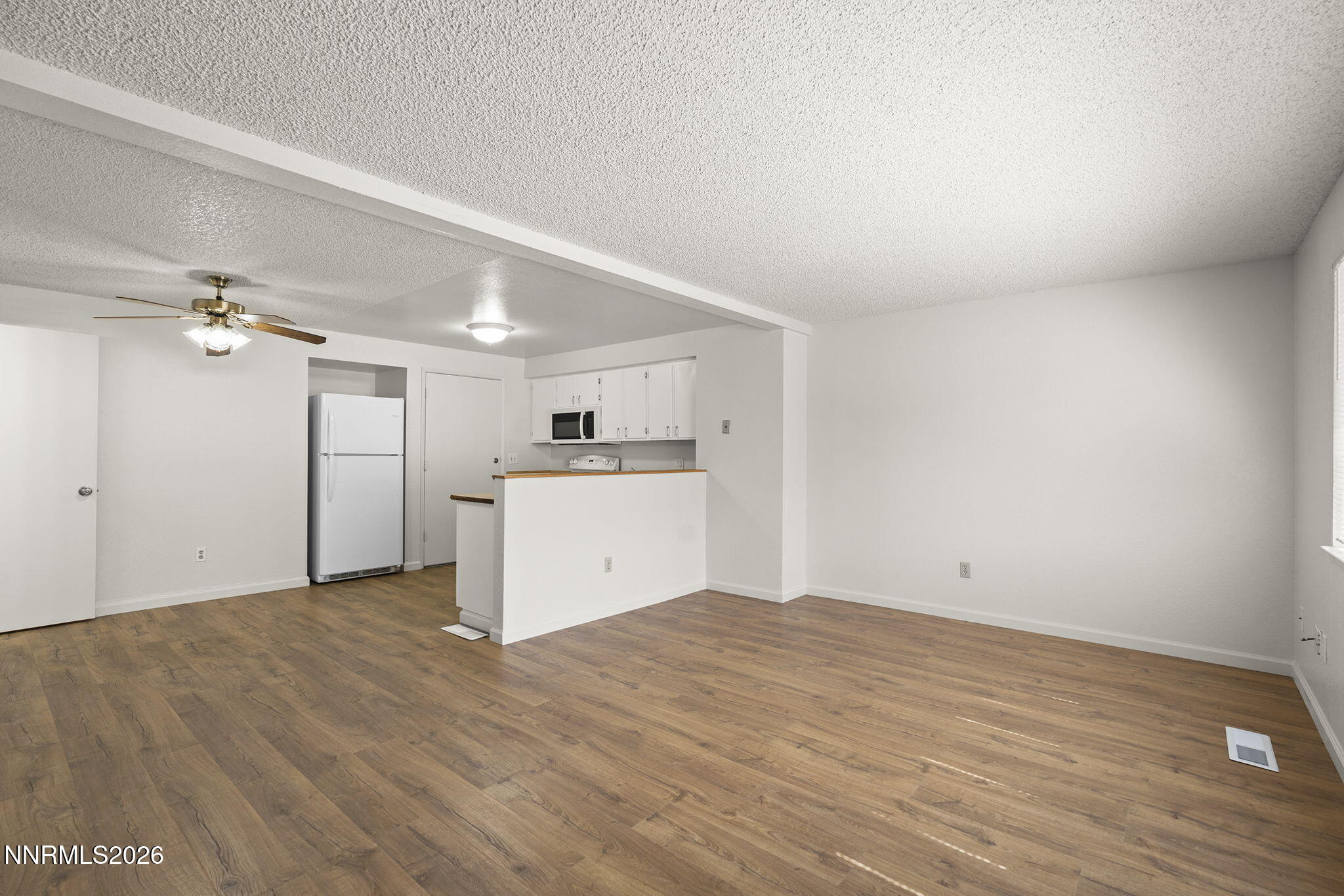 401 Allouette Way, Unit 2 Carson City, NV 89701 - Photo 7 of 29 a view of a kitchen with a sink and a refrigerator