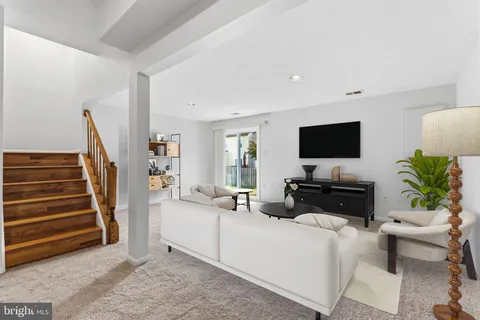 a bathroom with a sink toilet and mirror