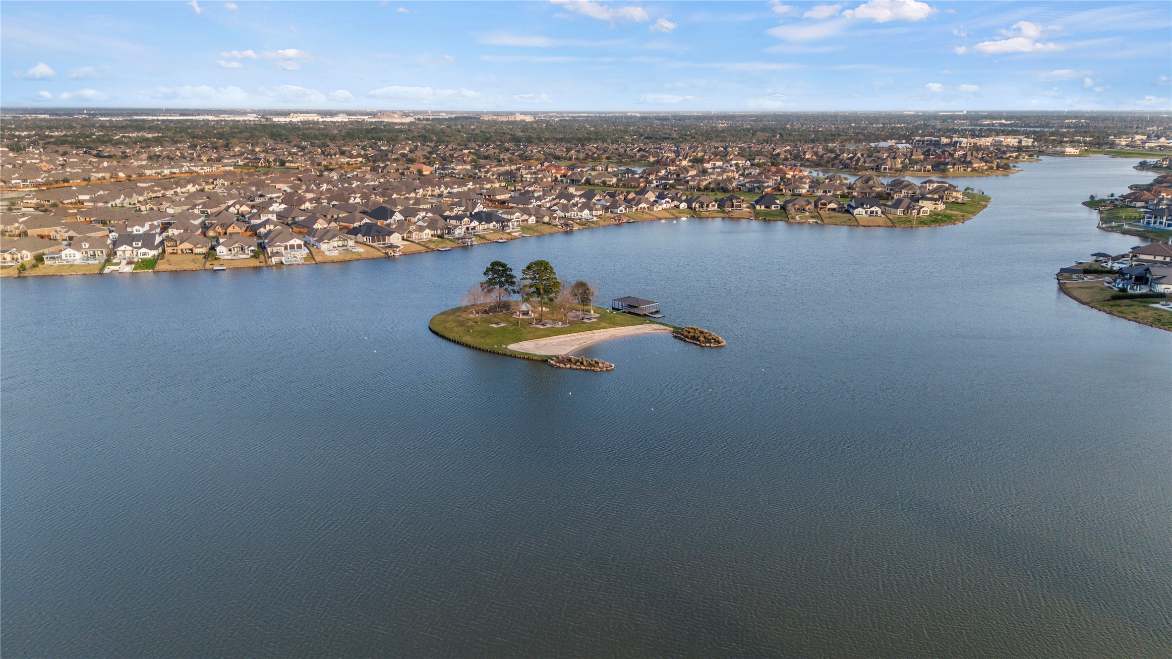 9438 Caddo Ridge Lane Cypress, TX 77433 - Photo 25 of 38 This photo showcases a serene waterfront community offering picturesque views and a tranquil setting. Ideal for buyers seeking a peaceful, scenic neighborhood!