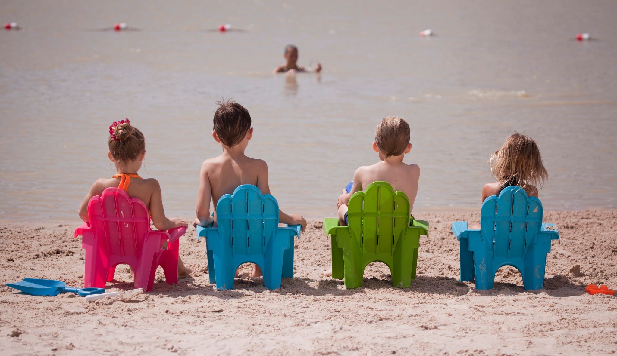 9438 Caddo Ridge Lane Cypress, TX 77433 - Photo 27 of 38 Everyone can enjoy a sunny day at a sandy beach, seated on colorful chairs near calm water. Perfect for waterfront fun and open year around!