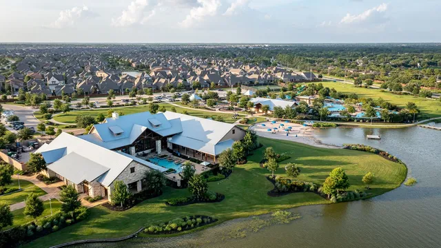 a view of a swimming pool and an outdoor seating