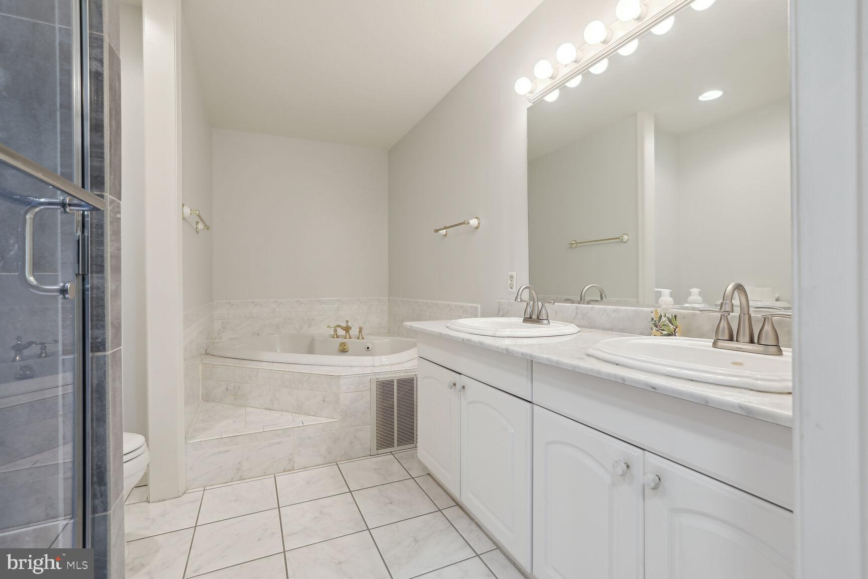 78 Burns Crossing Road Severn, MD 21144 - Photo 32 of 62 Primary Bathroom with marble jetted soaking tub